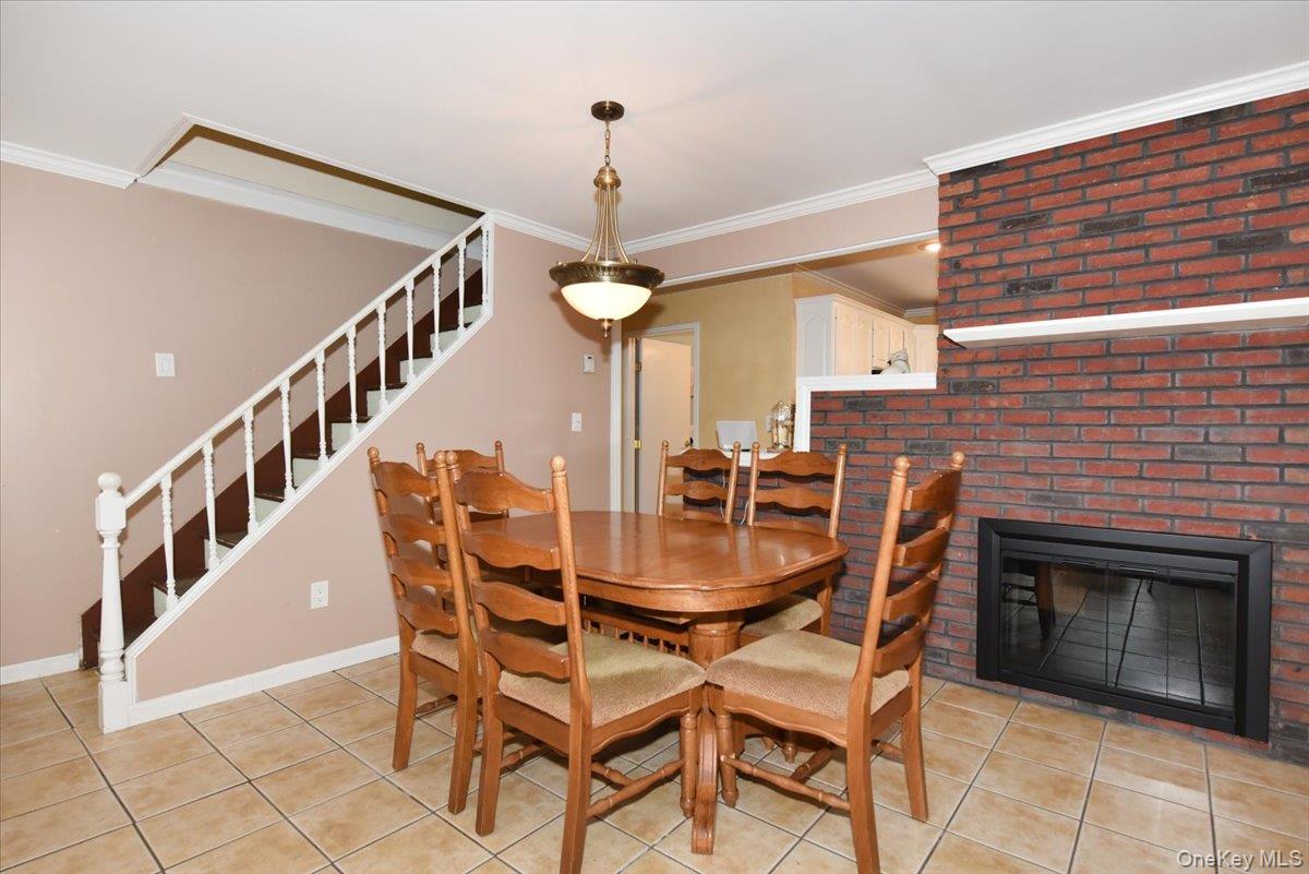 307 Blacksmith Road Levittown, NY 11756 - Photo 11 of 27 a dining room with furniture and entryway