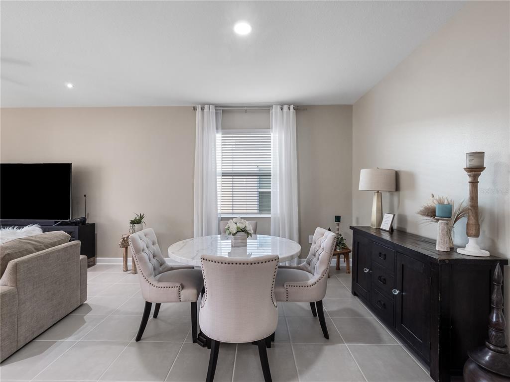 4531 Hillingdam Road Davenport, FL 33837 - Photo 13 of 36 a dining room with furniture and window