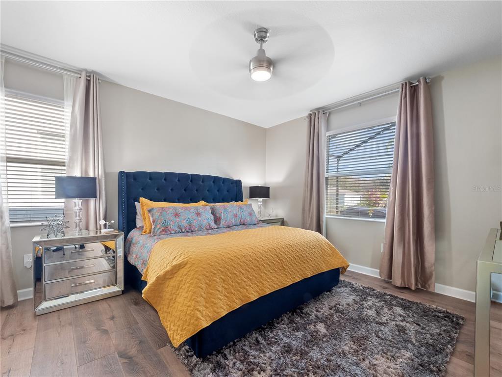 4531 Hillingdam Road Davenport, FL 33837 - Photo 14 of 36 a bedroom with a large bed and a window