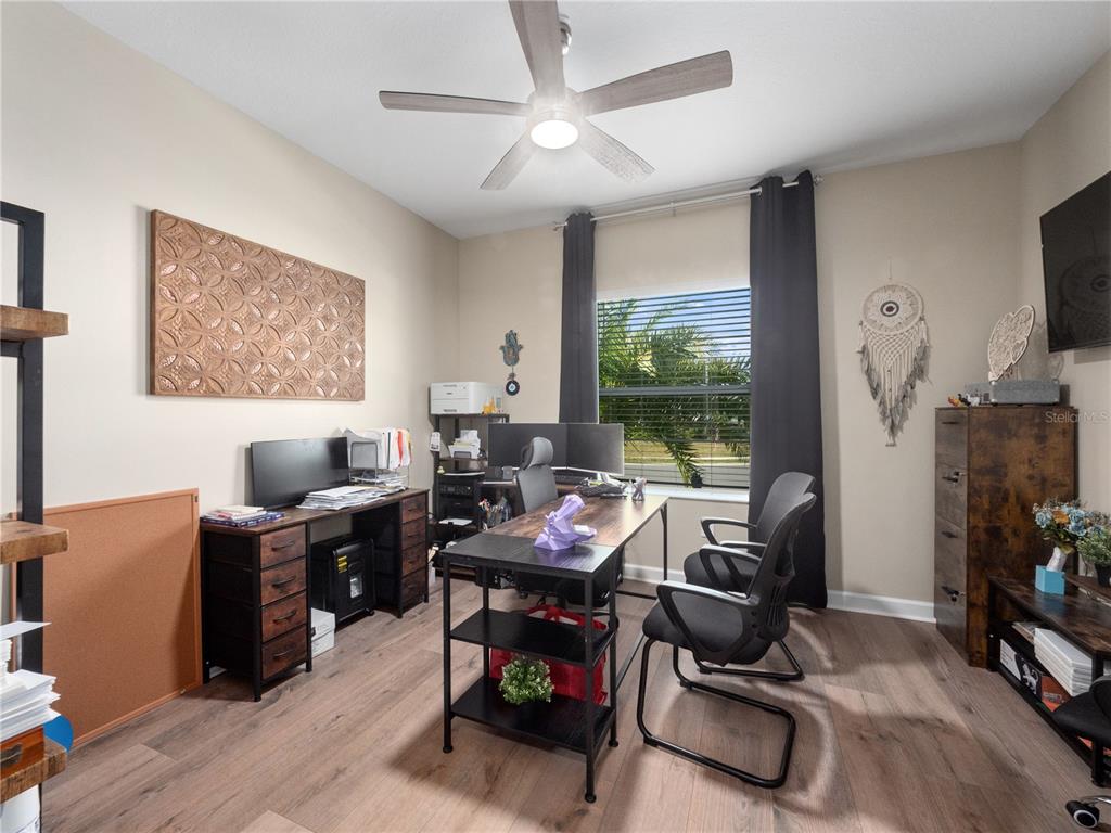 4531 Hillingdam Road Davenport, FL 33837 - Photo 21 of 36 a view of a workspace with furniture and a window