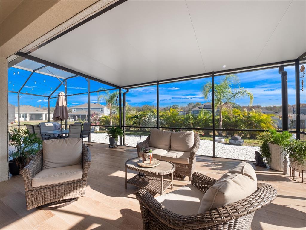 4531 Hillingdam Road Davenport, FL 33837 - Photo 3 of 36 a living room with patio furniture and a large window