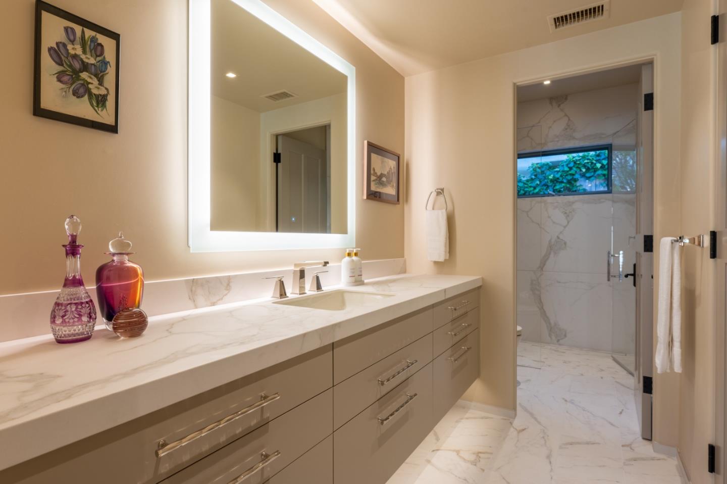1014 Broncho Road Pebble Beach, CA 93953 - Photo 13 of 24 a bathroom with a sink double vanity and mirror