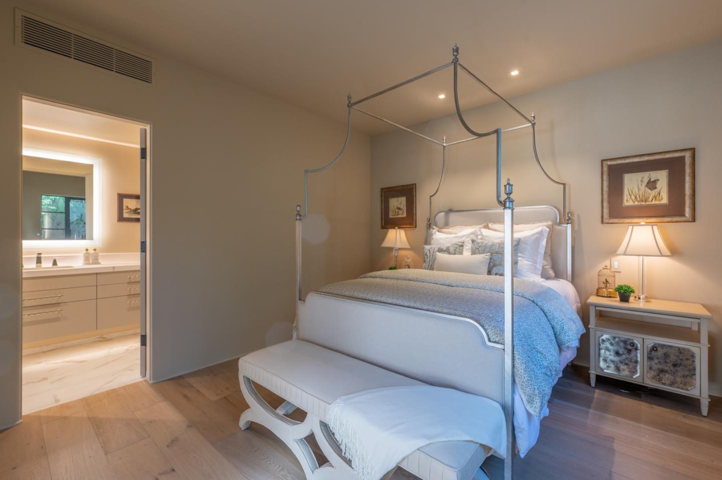 1014 Broncho Road Pebble Beach, CA 93953 - Photo 14 of 24 a bedroom with a bed and a mirror on the dresser