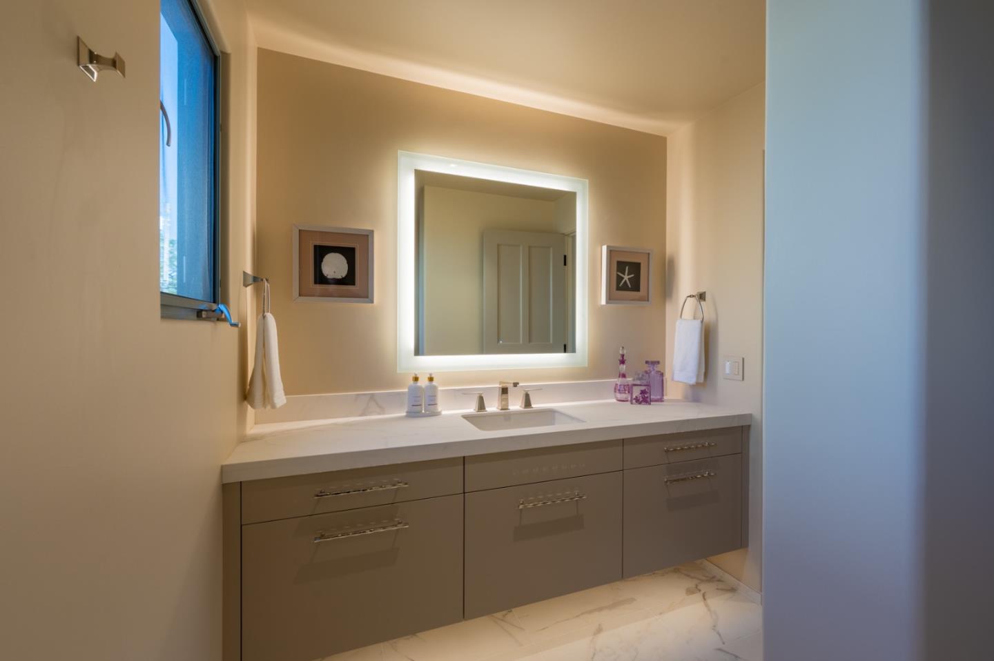 1014 Broncho Road Pebble Beach, CA 93953 - Photo 15 of 24 a bathroom with a sink and a mirror