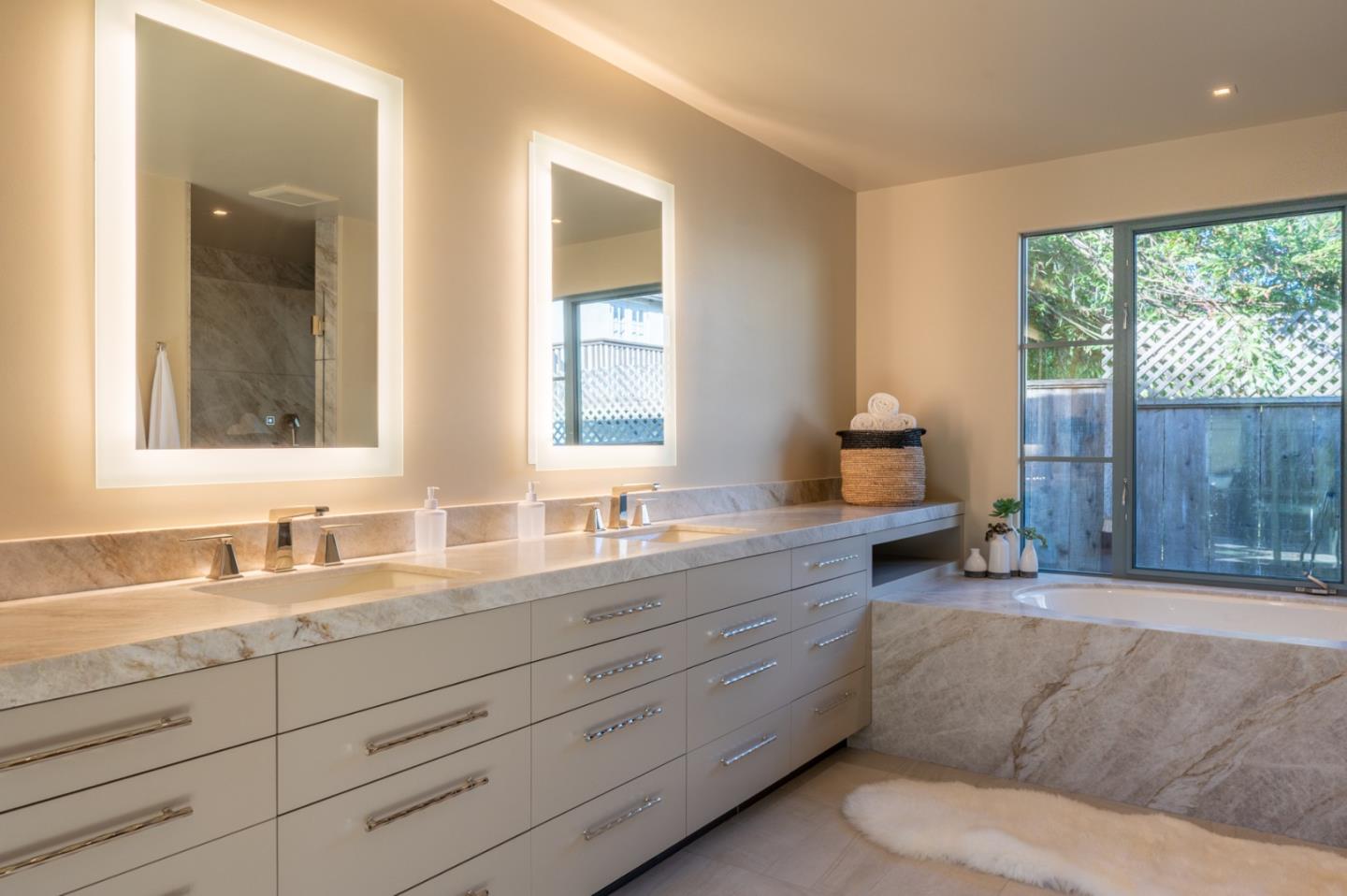 1014 Broncho Road Pebble Beach, CA 93953 - Photo 19 of 24 a spacious bathroom with double vanity and a mirror
