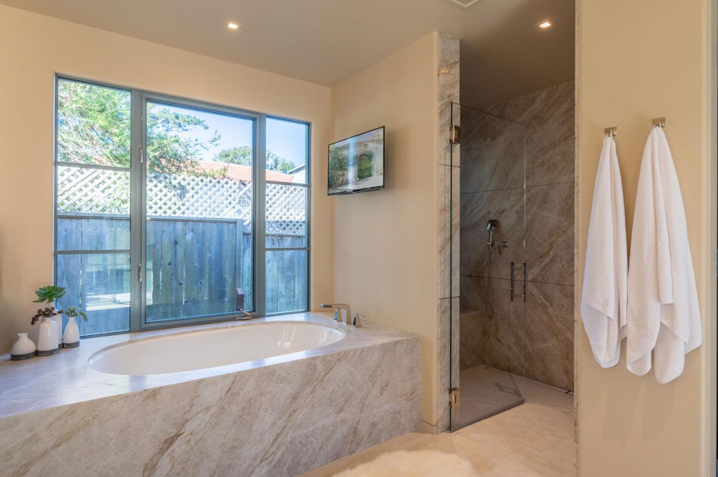 1014 Broncho Road Pebble Beach, CA 93953 - Photo 20 of 24 a spacious bathroom with a tub and shower