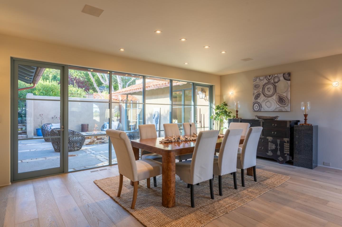 1014 Broncho Road Pebble Beach, CA 93953 - Photo 5 of 24 a view of a dining room with furniture and wooden floor