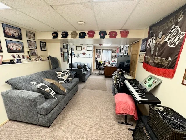 a living room with furniture gym equipment and a couch