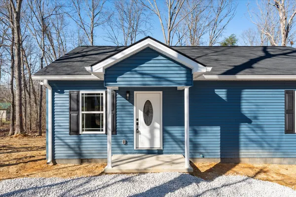 a front view of a house with garage
