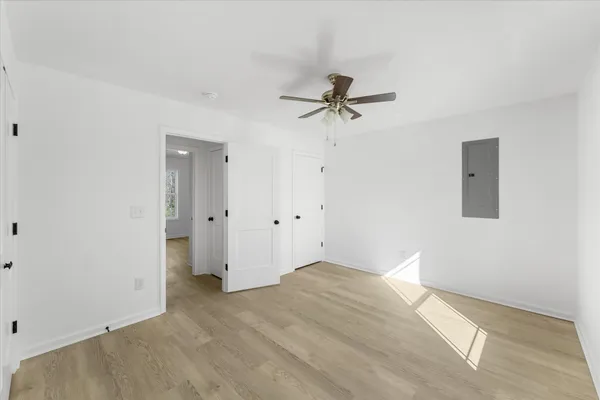 a view of empty room with ceiling fan