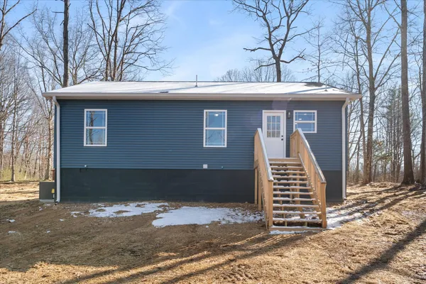 a front view of a house with stairs