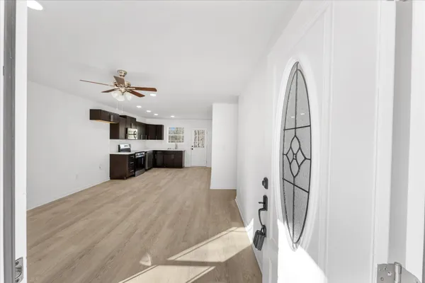 a view of a kitchen with furniture and a kitchen