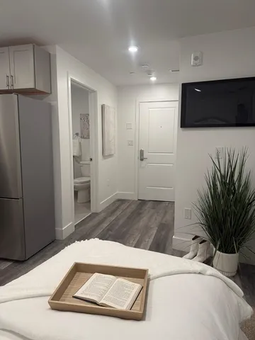 a view of a livingroom with a flat screen tv