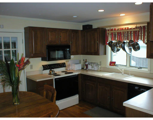 22 Bemis Road Newton, MA 02460 - Photo 2 of 14 a kitchen with a sink and cabinets