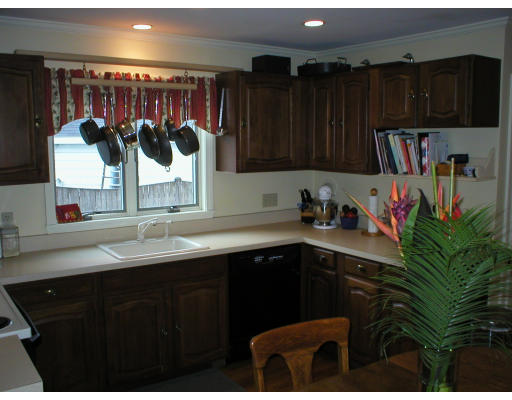 22 Bemis Road Newton, MA 02460 - Photo 3 of 14 a kitchen with a sink and cabinets
