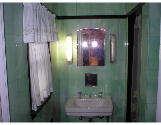 22 Bemis Road Newton, MA 02460 - Photo 10 of 14 a bathroom with a sink and a mirror