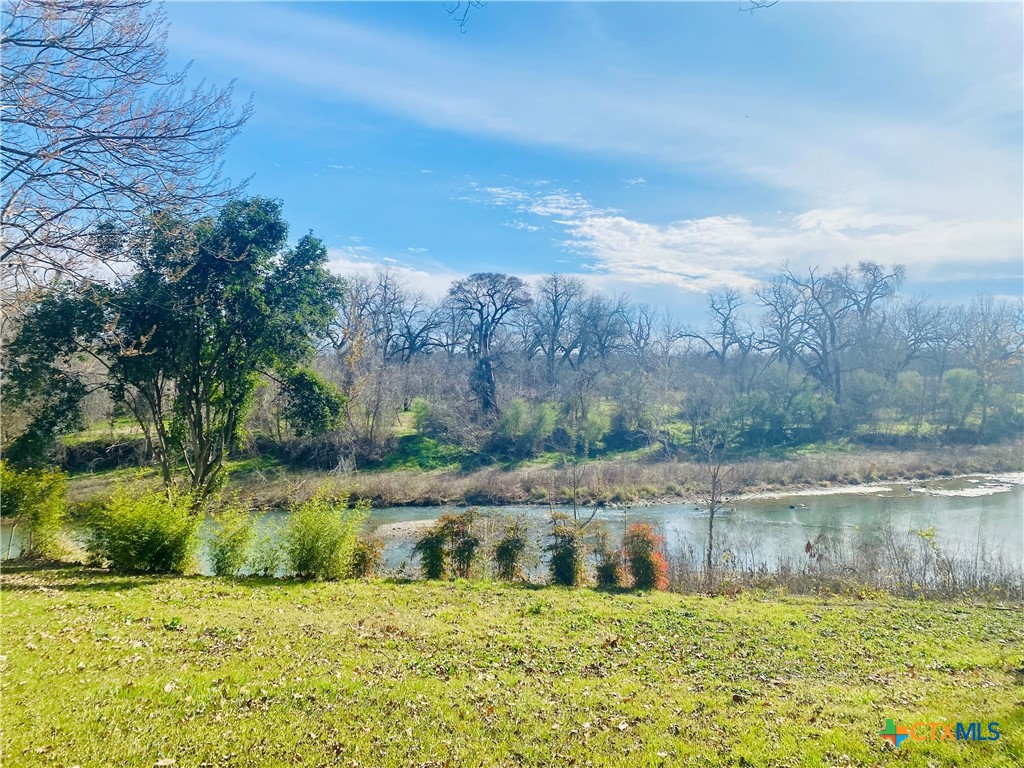0 West Hampton Drive Seguin, TX 78155 - Photo 4 of 6 a view of a lake with houses in the background
