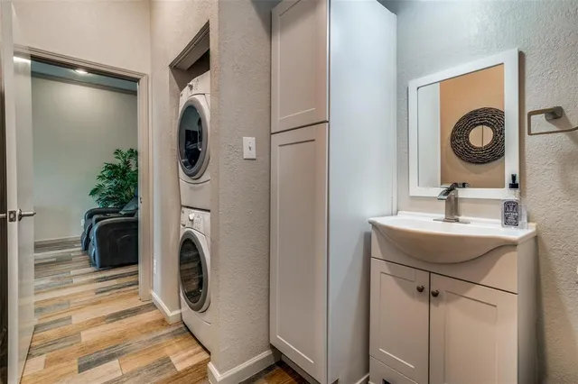 a bathroom with a sink and a washer dryer