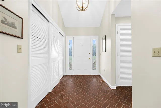 a view of room with window and hallway