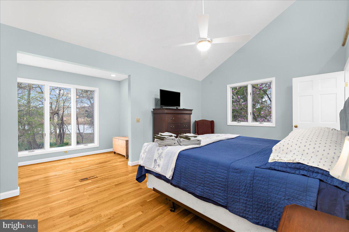 26889 Morgnec Road Chestertown, MD 21620 - Photo 15 of 32 a bedroom with a large bed and a window