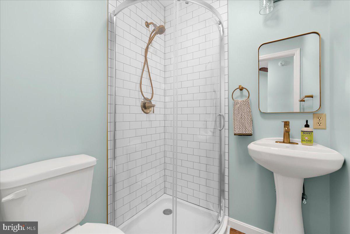 26889 Morgnec Road Chestertown, MD 21620 - Photo 19 of 32 a bathroom with a sink a toilet and shower