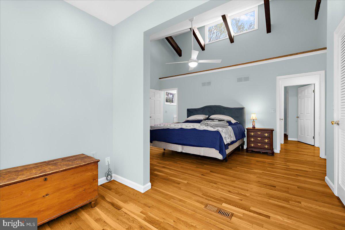 26889 Morgnec Road Chestertown, MD 21620 - Photo 5 of 32 a bedroom with a bed and wooden floor