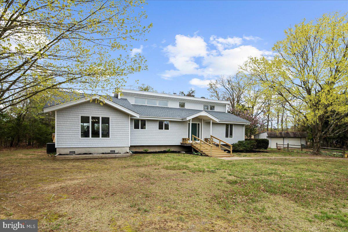 26889 Morgnec Road Chestertown, MD 21620 - Photo 9 of 32 a house that has a tree in front of it