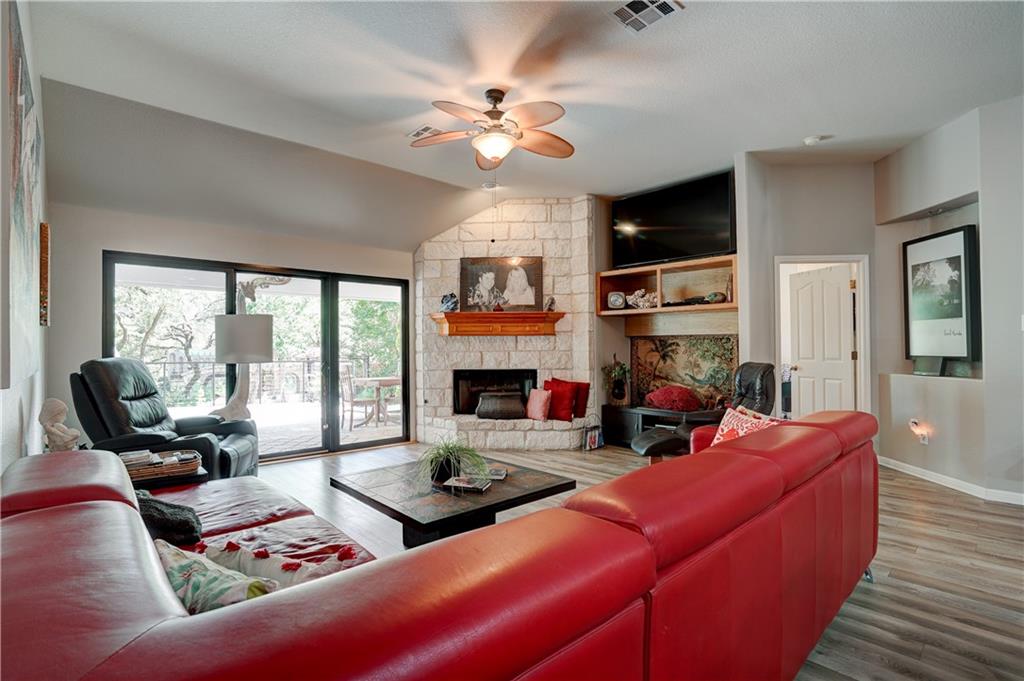 2513 Wanakah Ridge Drive Cedar Park, TX 78613 - Photo 14 of 34 a living room with furniture fireplace and a large window