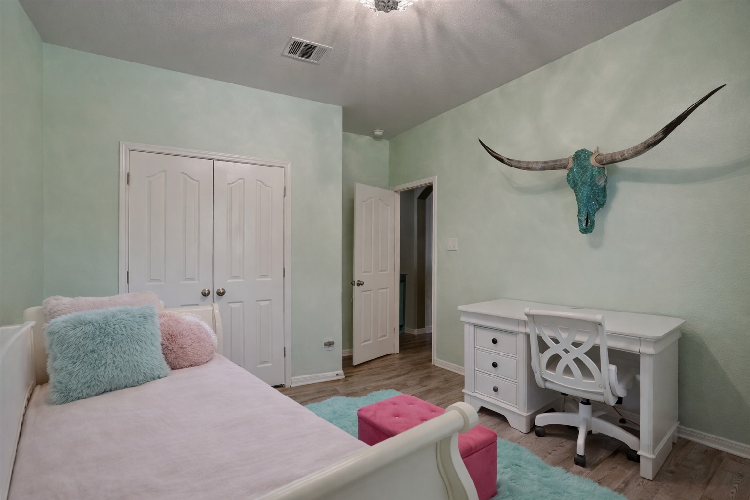 2513 Wanakah Ridge Drive Cedar Park, TX 78613 - Photo 25 of 34 a bedroom with a bed and a chair