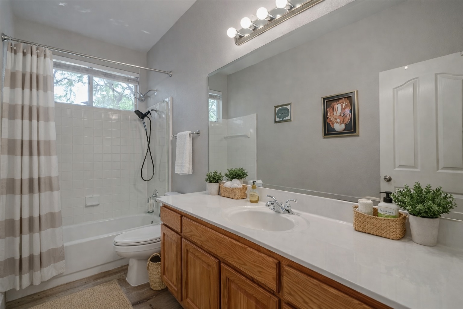 2513 Wanakah Ridge Drive Cedar Park, TX 78613 - Photo 26 of 34 a bathroom with a granite countertop sink a toilet a shower and a mirror