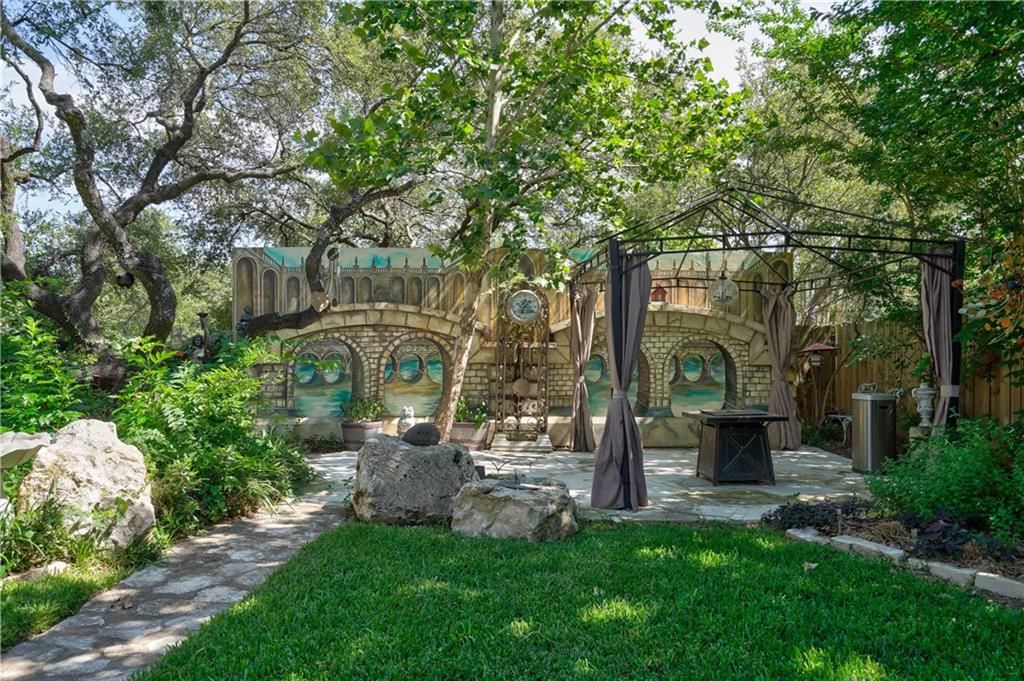 2513 Wanakah Ridge Drive Cedar Park, TX 78613 - Photo 32 of 34 a view of a garden with large trees