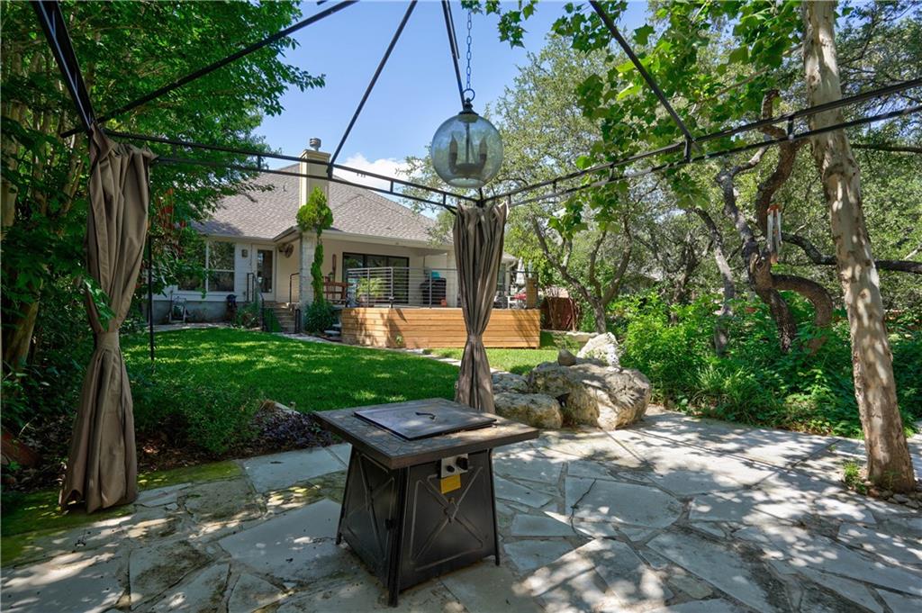 2513 Wanakah Ridge Drive Cedar Park, TX 78613 - Photo 33 of 34 a view of a chair and table in backyard of the house
