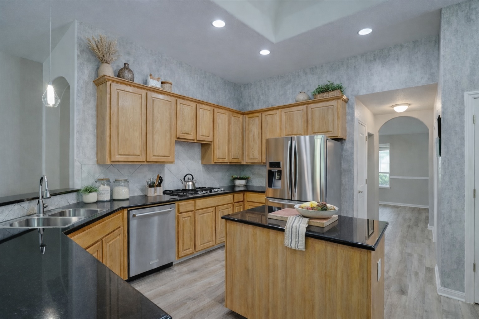 2513 Wanakah Ridge Drive Cedar Park, TX 78613 - Photo 6 of 34 a kitchen with kitchen island granite countertop a sink stainless steel appliances and cabinets