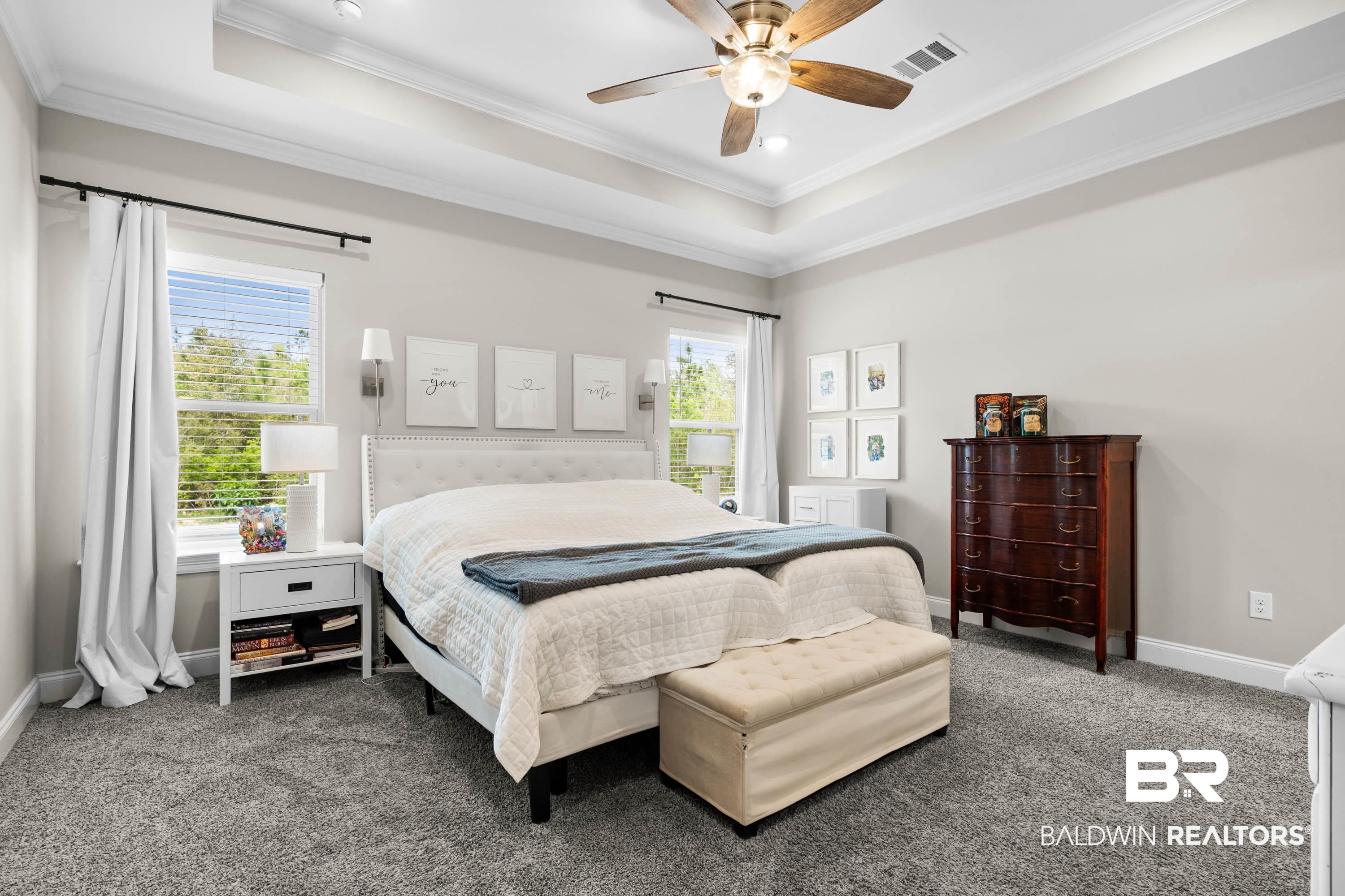 7150 Powell Road, Unit LOT 6A Eight Mile, AL 36613 - Photo 10 of 35 Bedroom featuring a tray ceiling, ornamental molding, ceiling fan, and carpet flooring