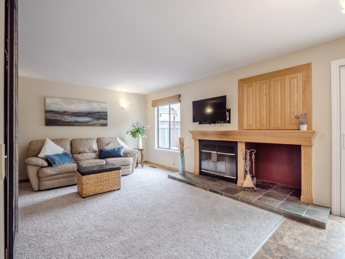 46 Sears Circle Soquel, CA 95073 - Photo 13 of 50 a living room with furniture a fireplace and a flat screen tv