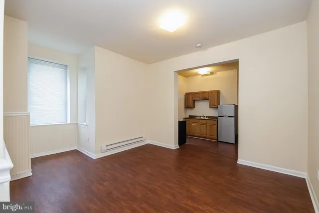 a view of a kitchen with a sink dishwasher and a refrigerator