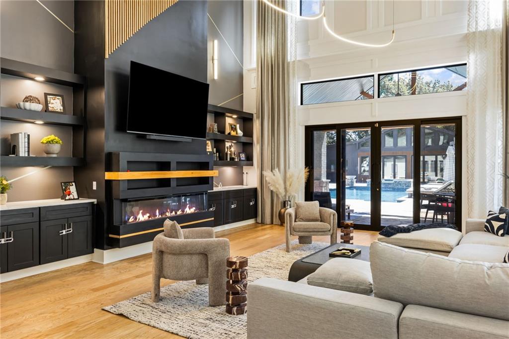 2641 Camp Branch Road Buford, GA 30519 - Photo 12 of 44 a living room with furniture and a flat screen tv