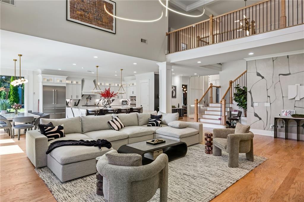 2641 Camp Branch Road Buford, GA 30519 - Photo 14 of 44 a living room with furniture kitchen view and a chandelier