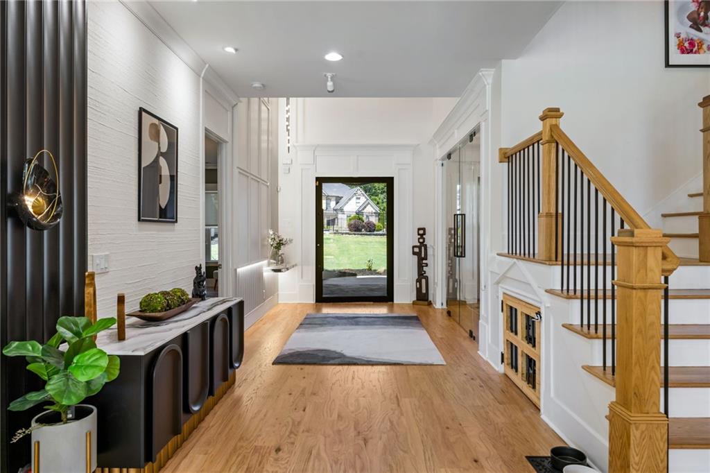 2641 Camp Branch Road Buford, GA 30519 - Photo 15 of 44 a hallway with wooden floor and staircase