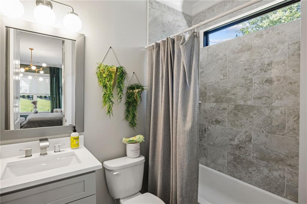 2641 Camp Branch Road Buford, GA 30519 - Photo 18 of 44 a bathroom with a toilet and a shower