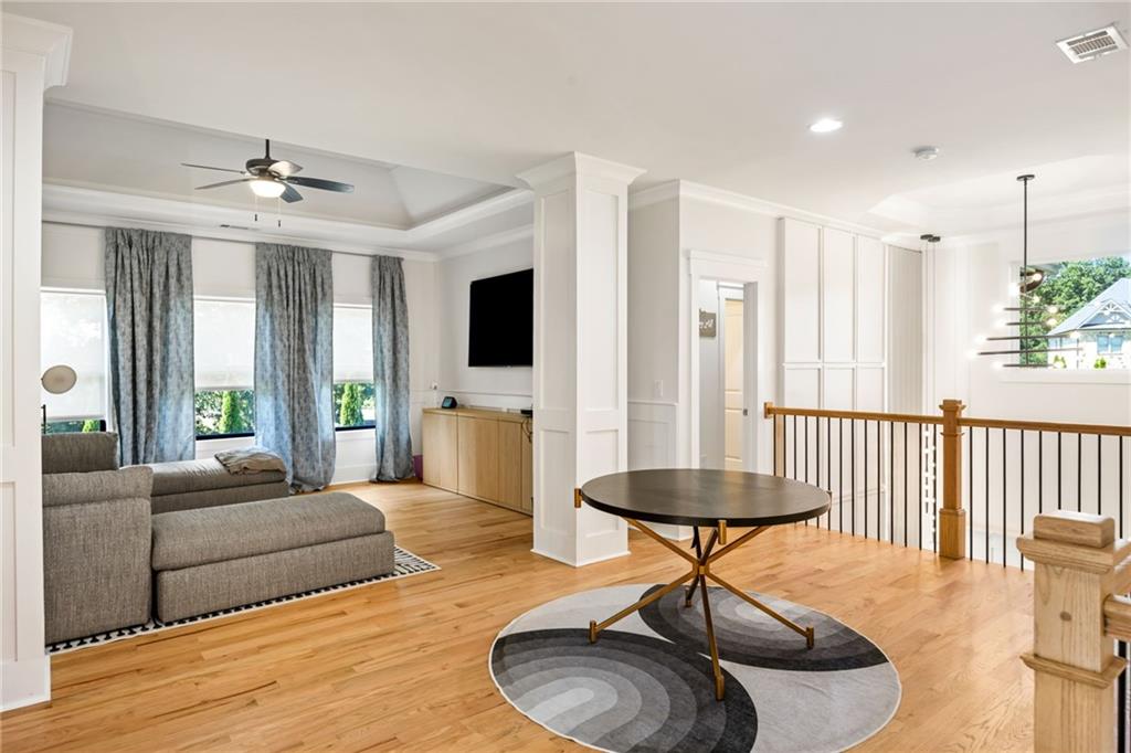 2641 Camp Branch Road Buford, GA 30519 - Photo 22 of 44 a living room with furniture a fireplace and a chandelier