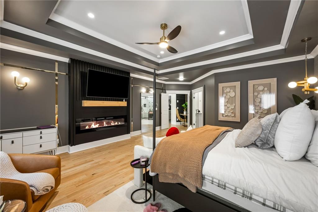 2641 Camp Branch Road Buford, GA 30519 - Photo 24 of 44 a bedroom with a bed and a flat screen tv