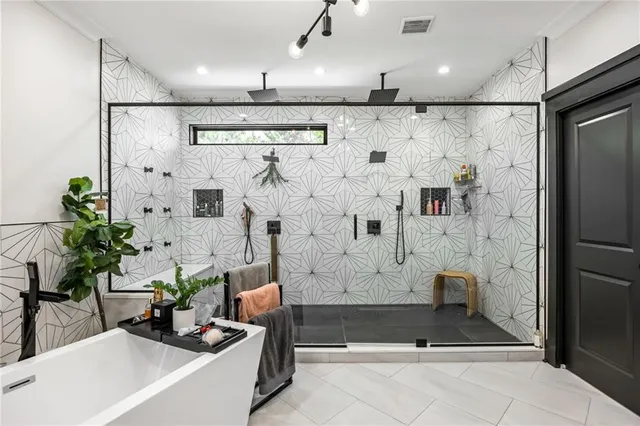 a room with a sink vanity and mirror