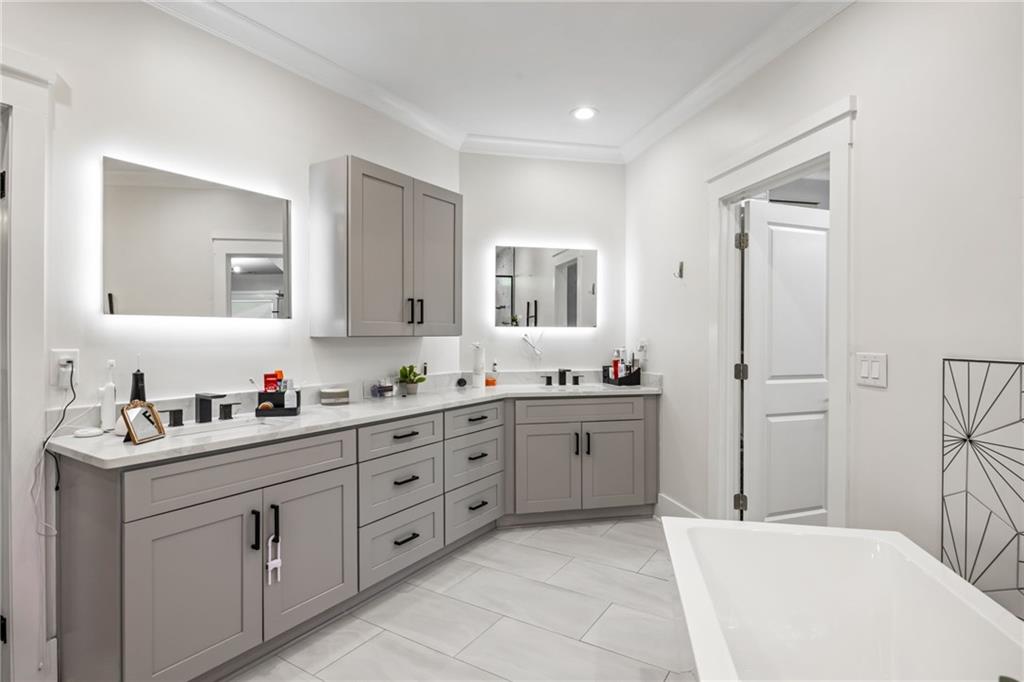 2641 Camp Branch Road Buford, GA 30519 - Photo 28 of 44 a room with a sink vanity and mirror