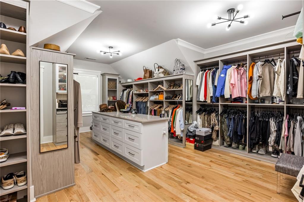 2641 Camp Branch Road Buford, GA 30519 - Photo 29 of 44 a view of walk in closet with clothes and shoes