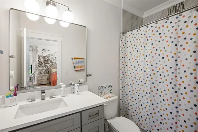 a bed room with a bed couch and dresser