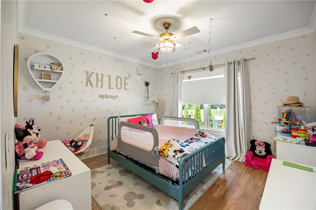 2641 Camp Branch Road Buford, GA 30519 - Photo 32 of 44 a bed room with a bed couch and dresser