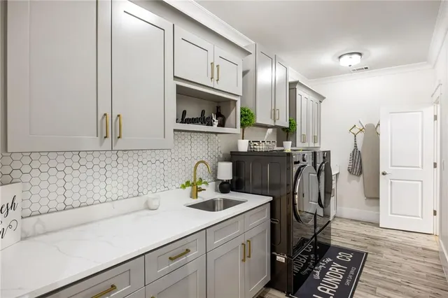 a bedroom with a bed window and a flat screen tv