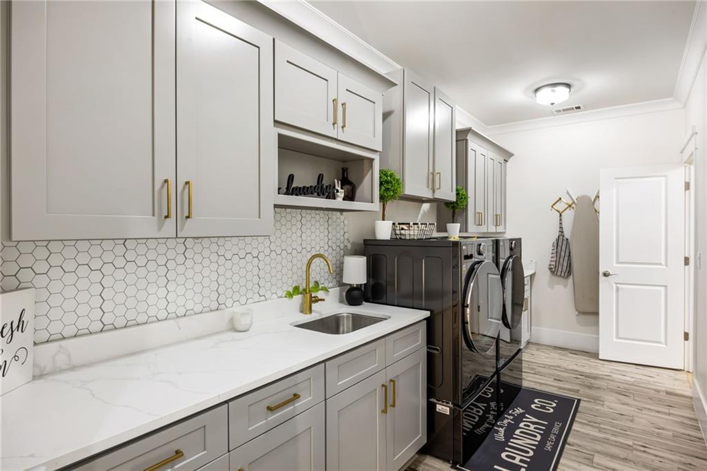 2641 Camp Branch Road Buford, GA 30519 - Photo 34 of 44 a kitchen with stainless steel appliances a sink a stove and cabinets