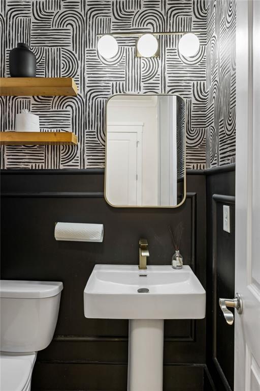 2641 Camp Branch Road Buford, GA 30519 - Photo 38 of 44 a bathroom with a toilet a sink and mirror